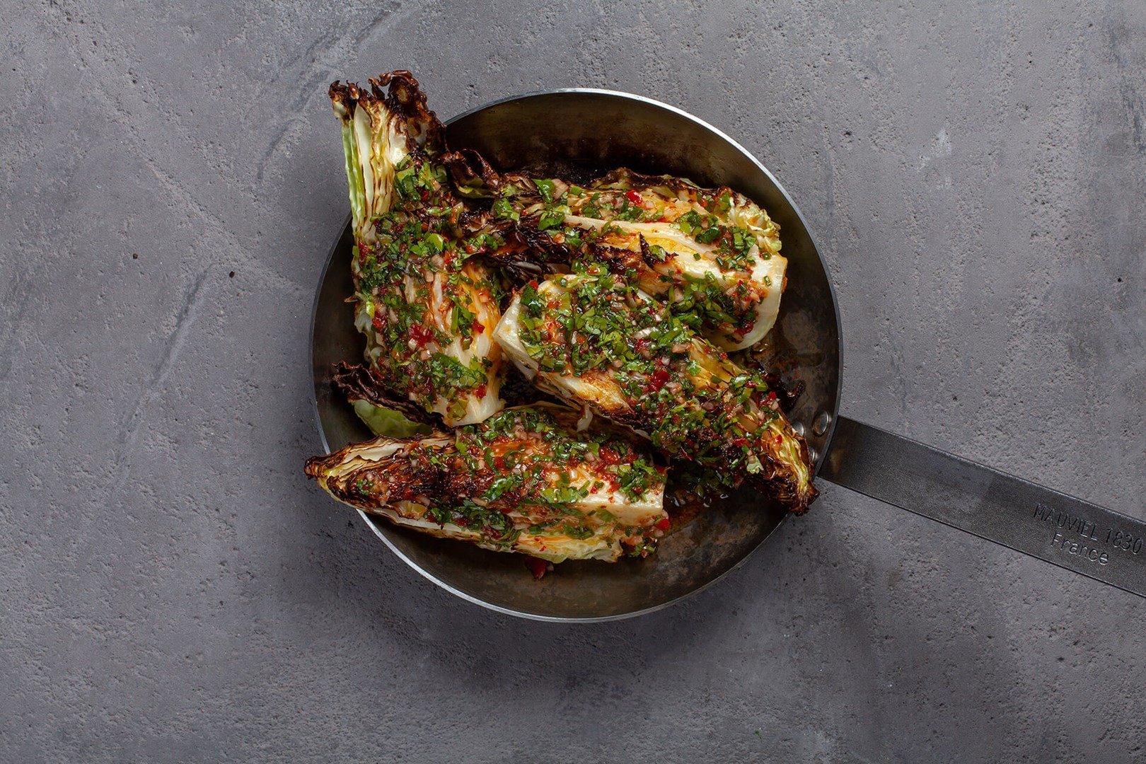 Frying pan with oven baked pointed cabbage