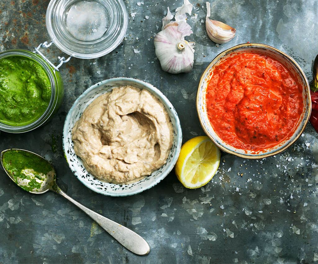 Bowls with three different sauces that goes along well with BBQ