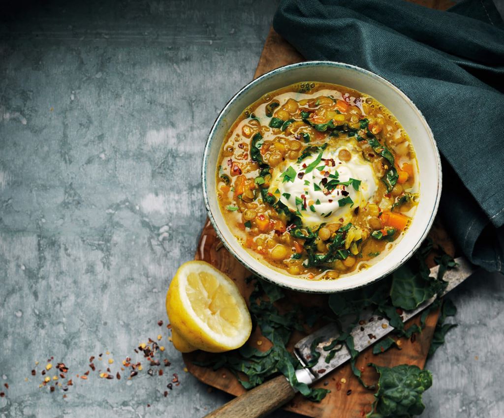 Lentil soup with crème fraiche in a bowl