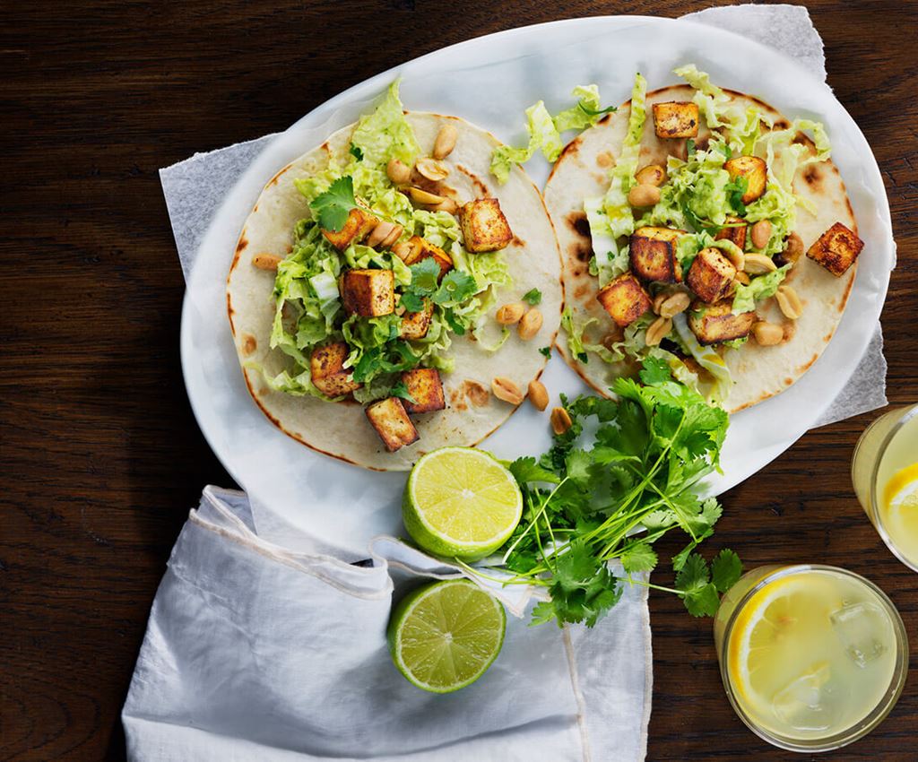 Two tofu tacos on a plate